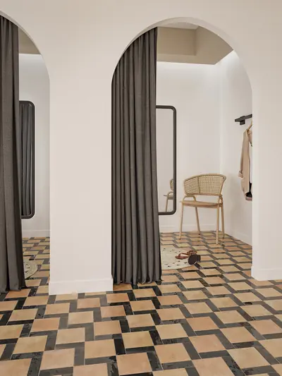 Arched doorway above a herringbone floor in black, terracotta and sand bejmat