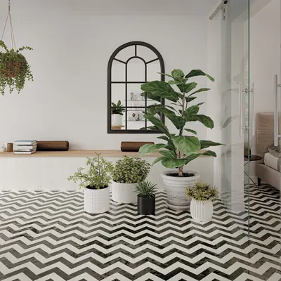 Black and white bejmat laid as a chevron across a floor lined with potted plants