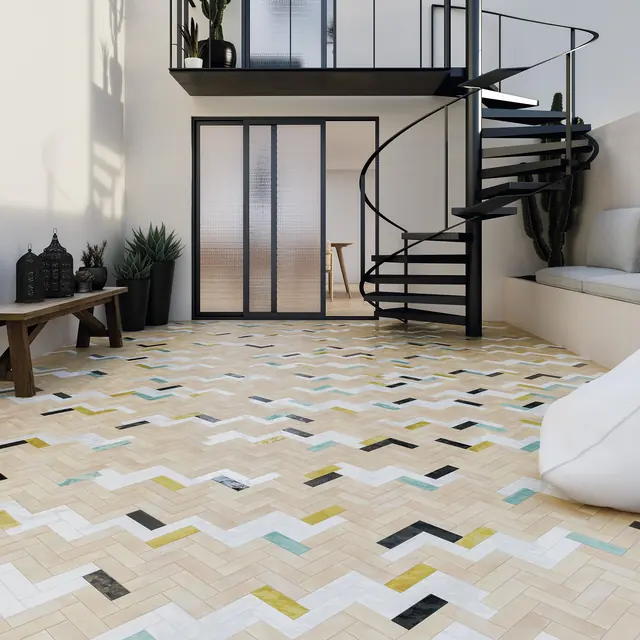 A bejmat floor with scattered coloured tiles running to the foot of a staircase