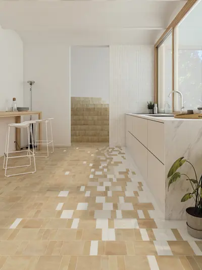 White kitchen with a sand bejmat floor scattered with white and pale tiles