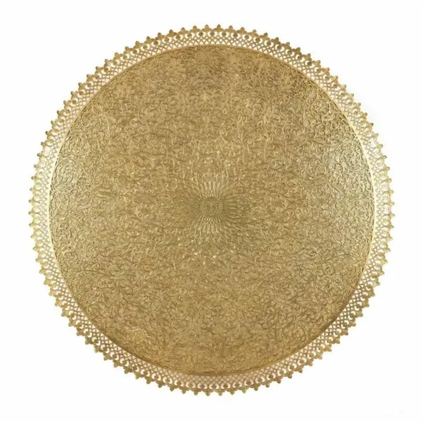 Filigree Wall Lamp - Open filigree brasswork over a warm interior glow.