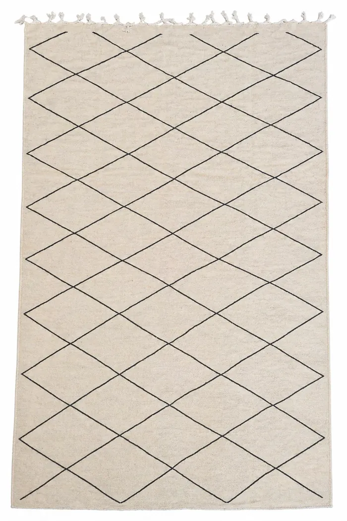 Diagonal Cross Lattice - A simpler diagonal grid, dark lines on undyed wool.
