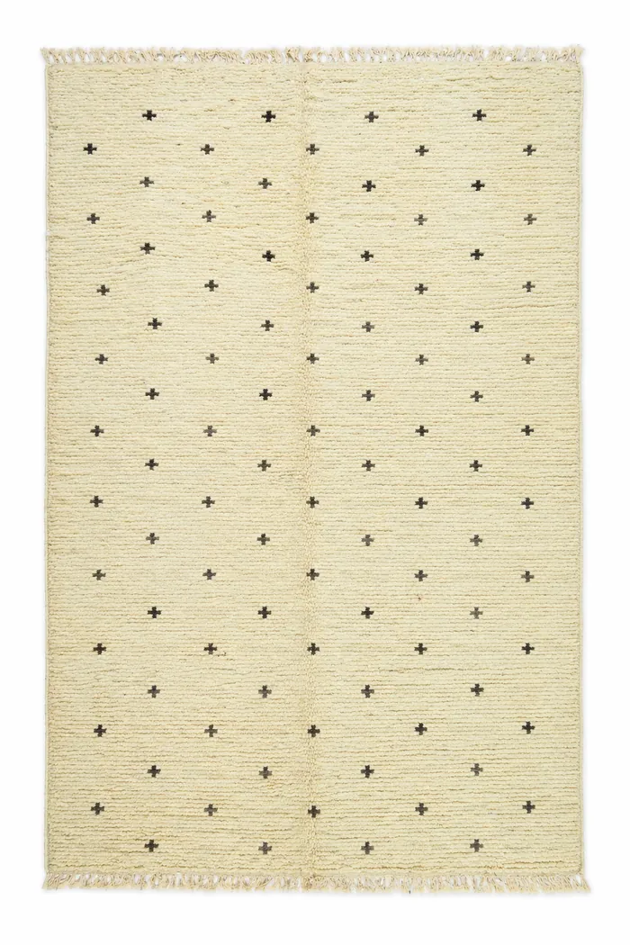 Ivory Dot Field - A quiet scatter of small dark motifs across plain ivory.